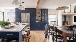 Kitchen with navy island and millwork