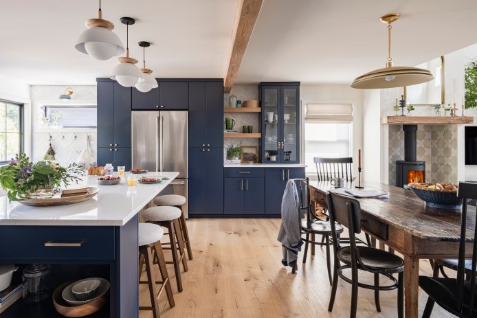 Kitchen with navy island and millwork