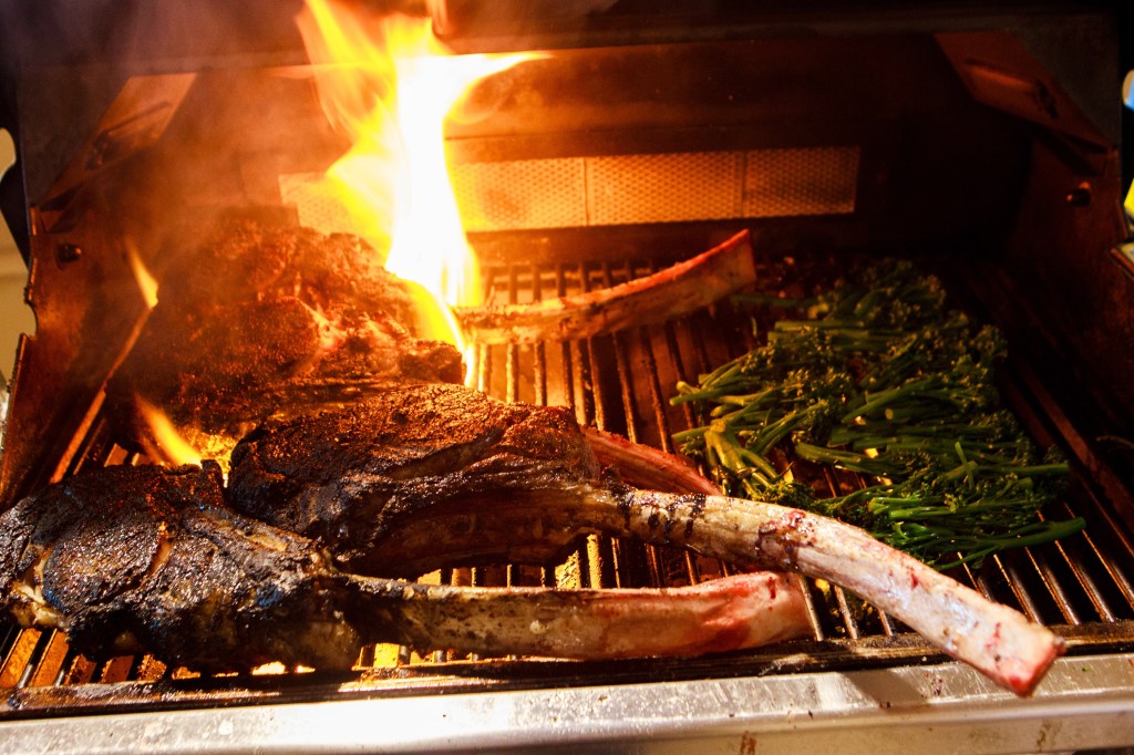 Grilling steak at Paws Up Montana