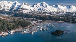 Cordova, Alaska from the air showing harbor and mountains.