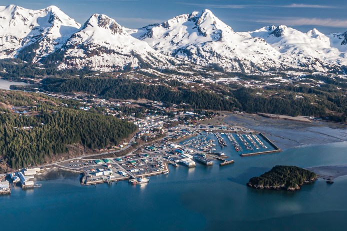Cordova, Alaska from the air showing harbor and mountains.
