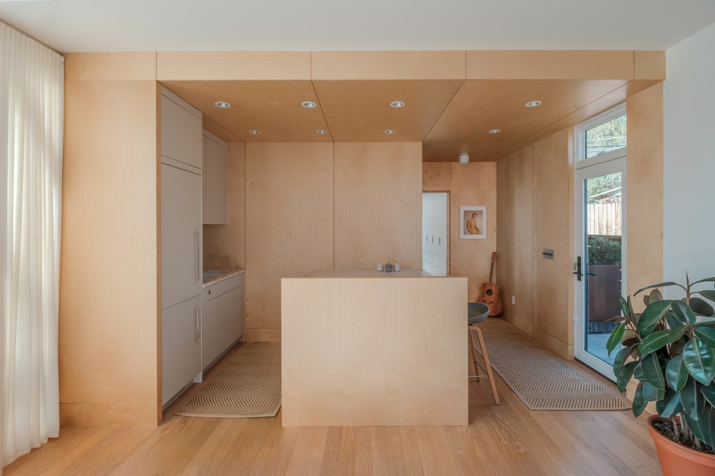 Kitchen in ADU by Flower Architecture