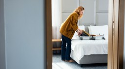Woman Packing Hotel Room