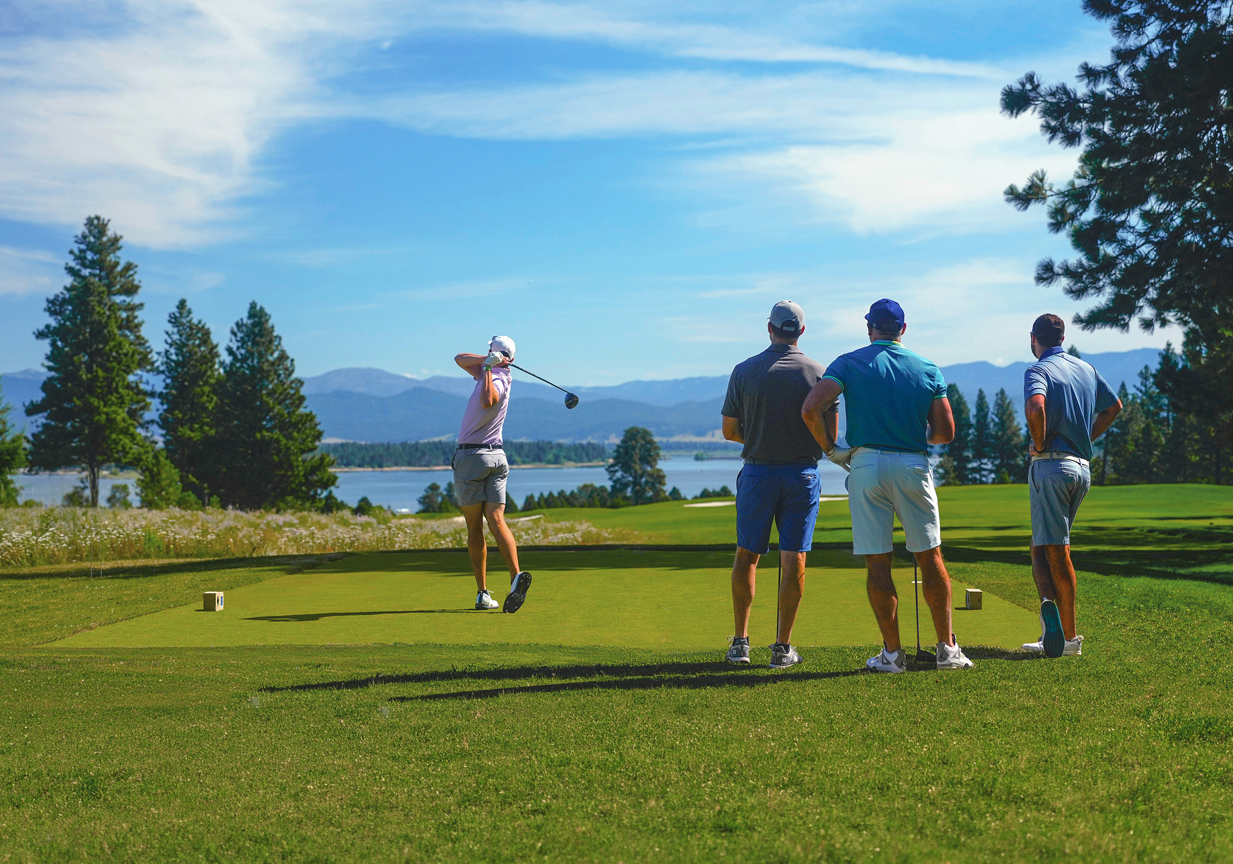 a-group-of-golfers-enjoy-tamarack-resorts-osprey-meadows-golf-course