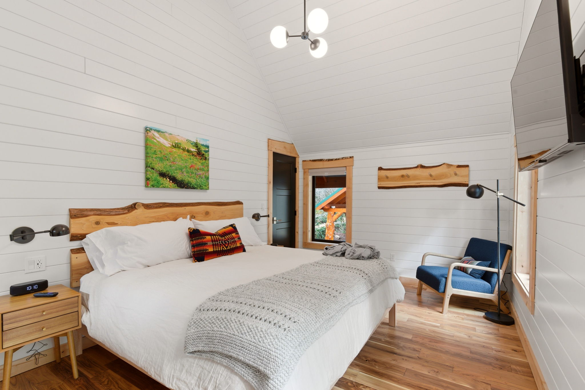 the-king-bedroom-hand-milled-cedar-headboard-jennifers-own-photography-on-the-walls-forest-views-beyond