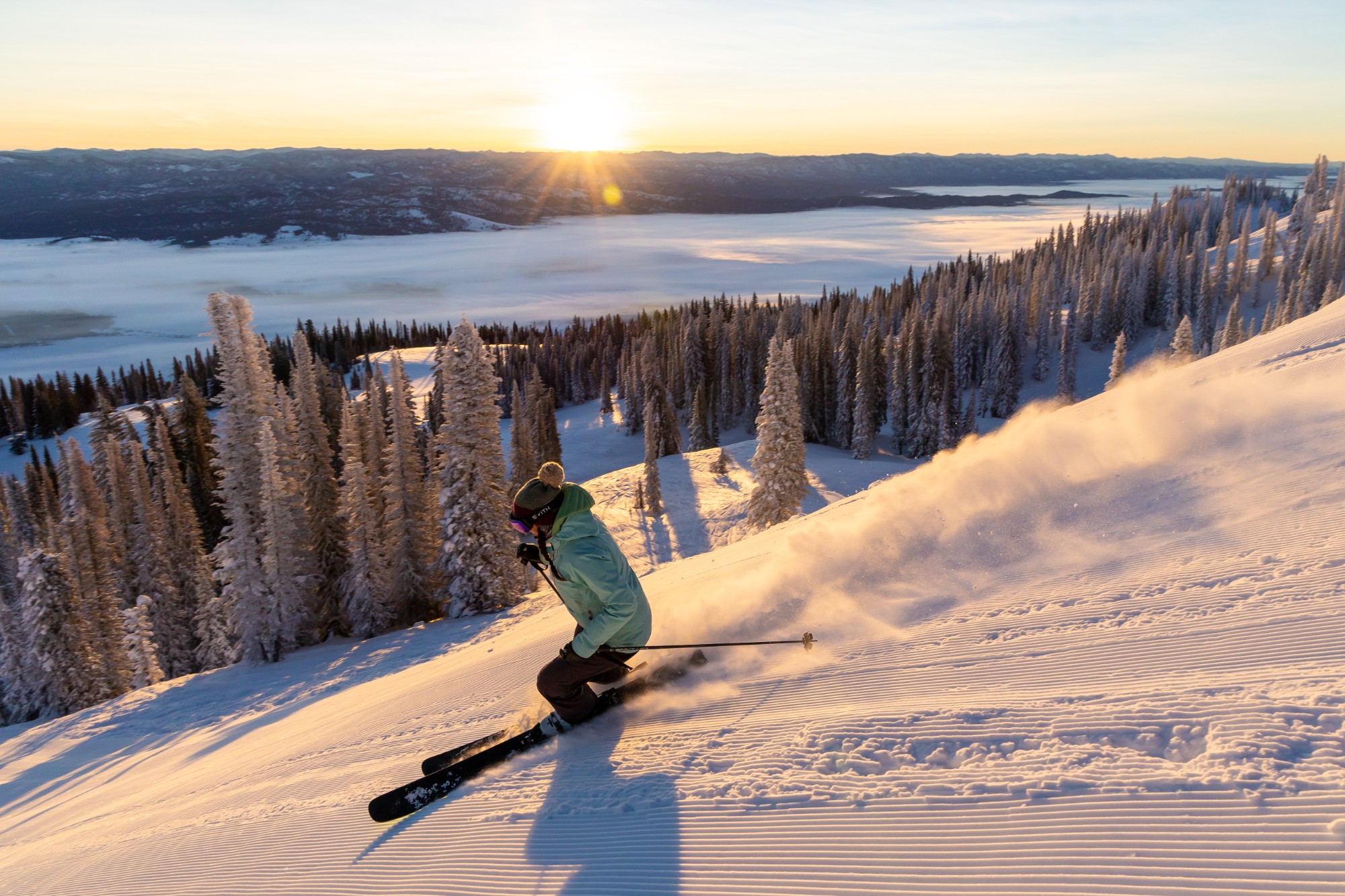 a-skier-carves-on-a-freshly-groomed-trail-at-tamarack-resort