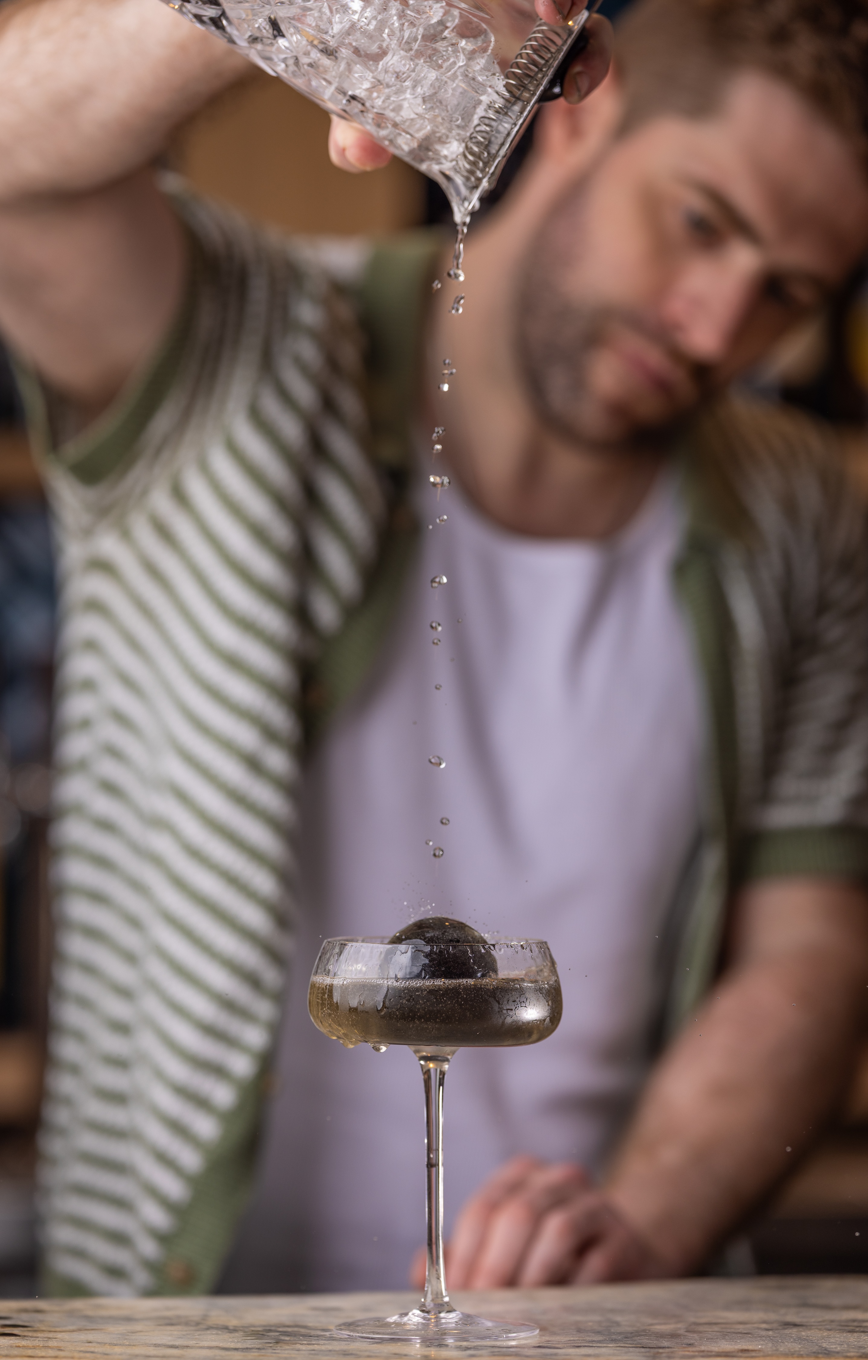 new-moon-cocktail-with-squid-ice-sphere