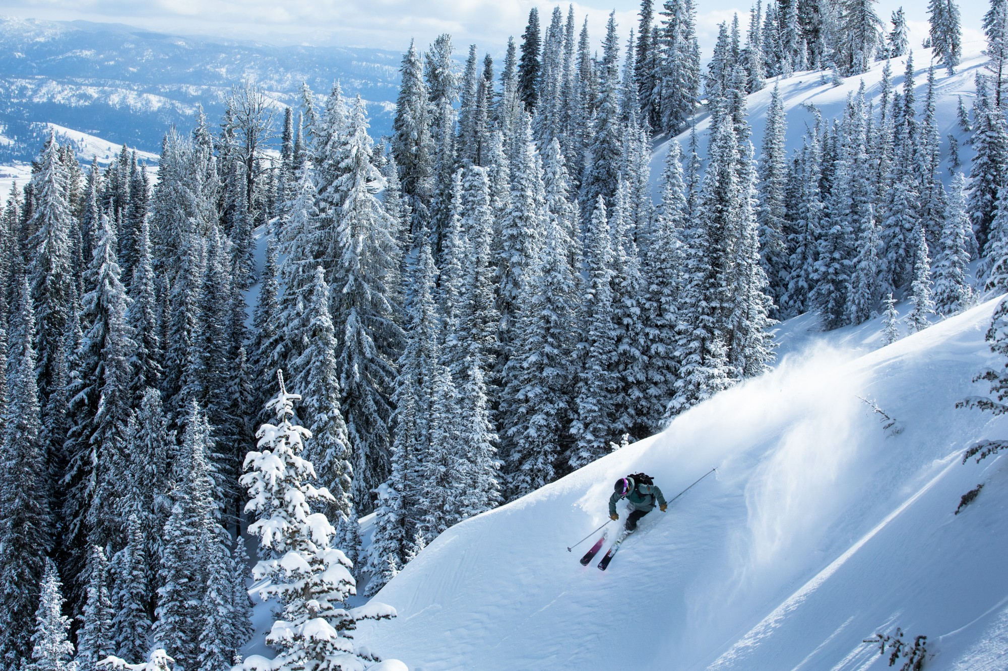 a-skier-shreds-the-powder-at-tamarack-resort