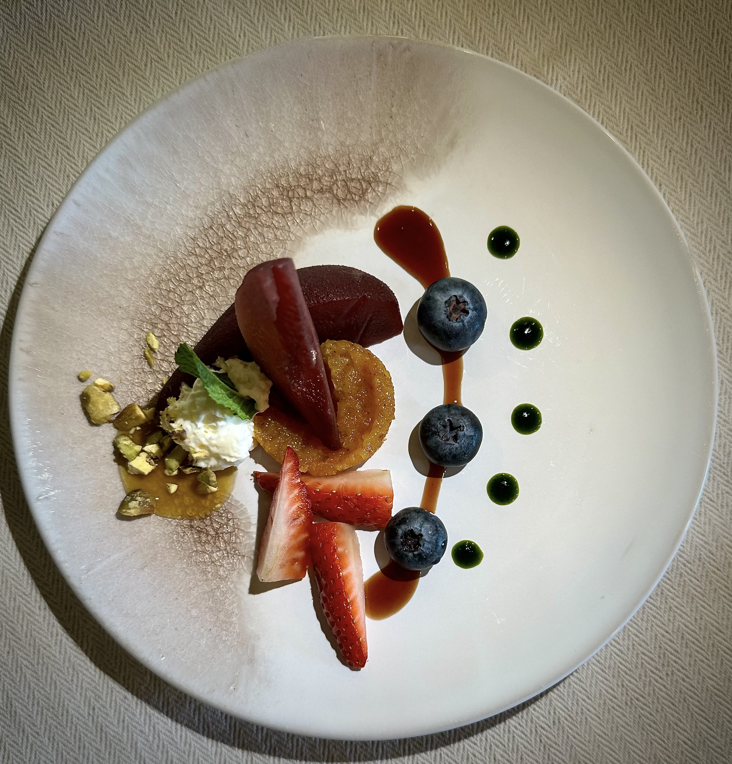 red-wine-poached-pear-blueberries-strawberries-and-crema-dulce