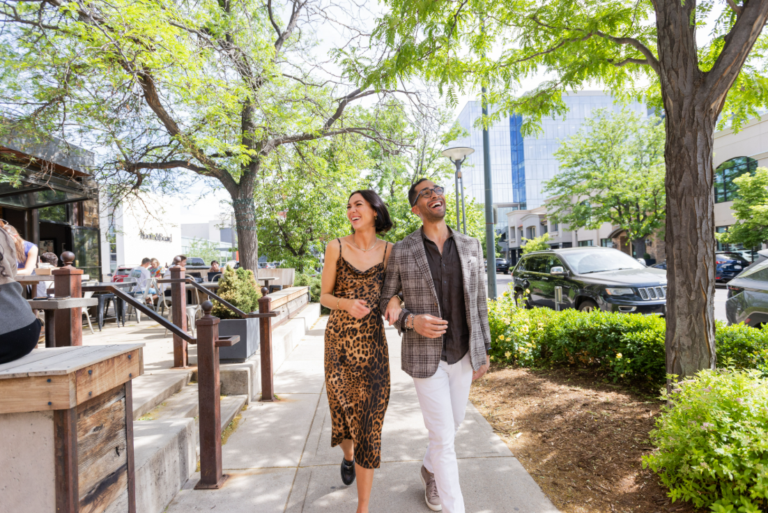couple-walking-under-cherry-creek-norths-tree-canopy