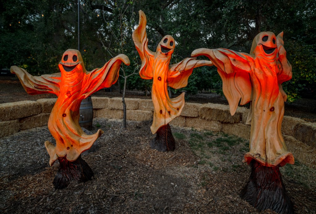 Carved wooden ghosts.