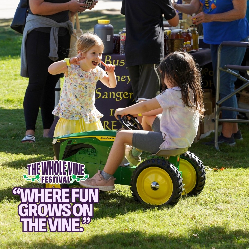 Girls playing on tractor.