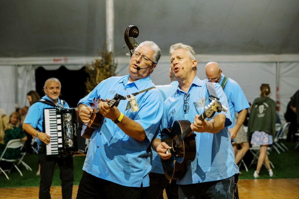 Balkan musicians signing.