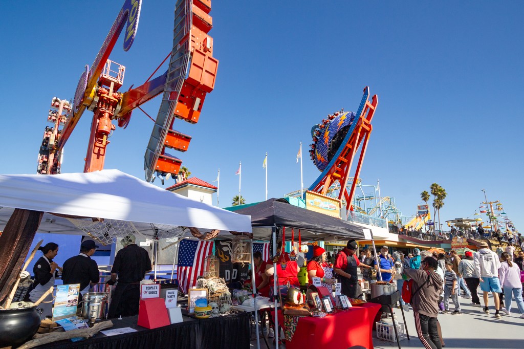 Santa Cruz Boardwalk with chili stand and rides.