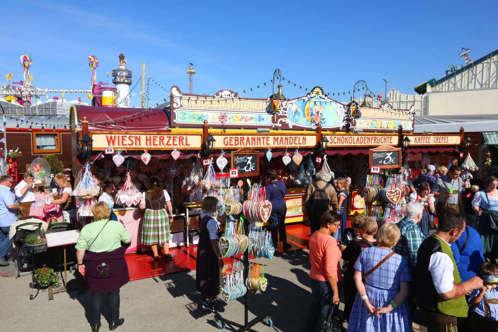 Oktoberfest festival stands with peoplebuying souveniers.