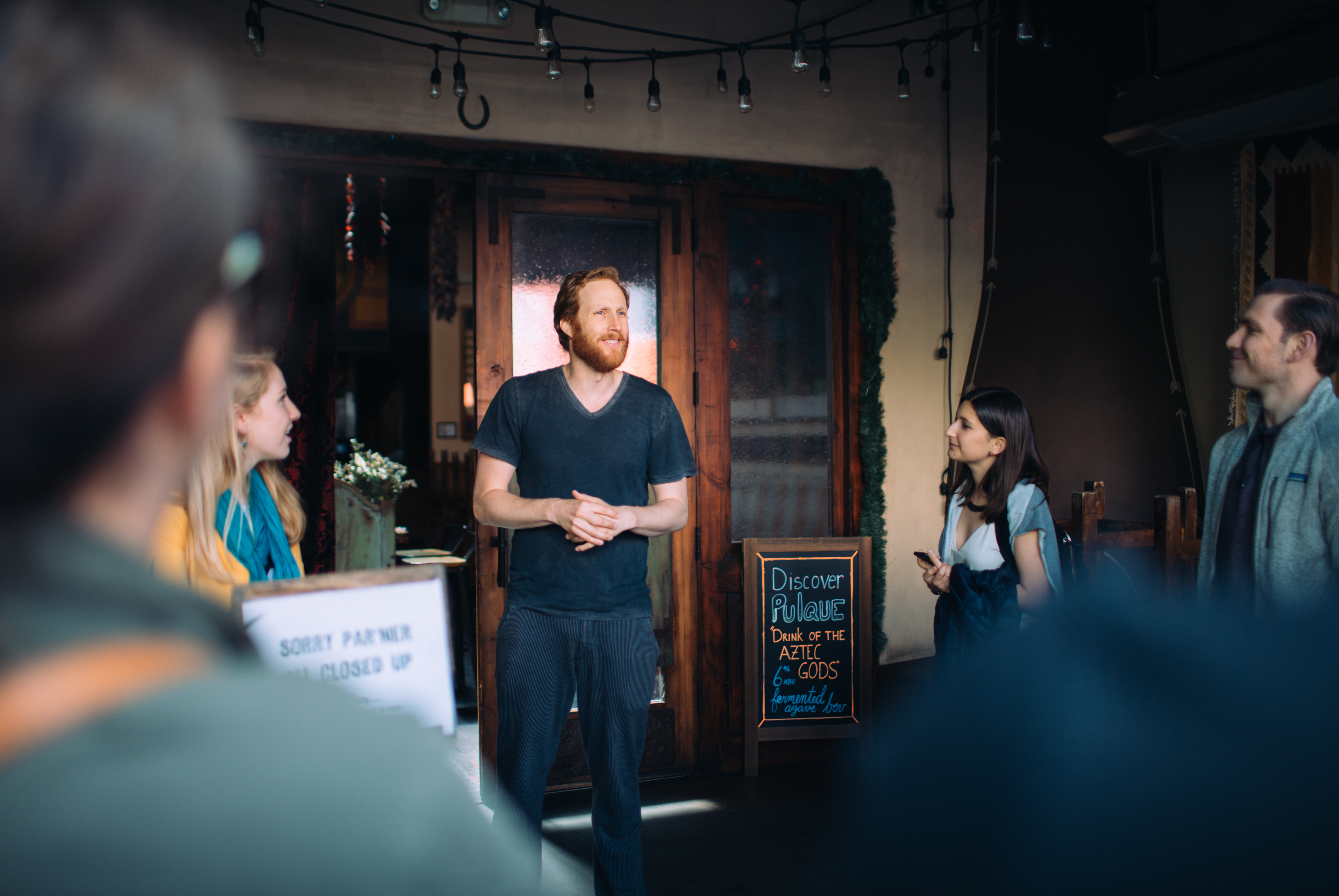 Avital Tours Brooke Porter. Mission District Food Tour. Tyler at West of pecos speaking to group outside.jpg