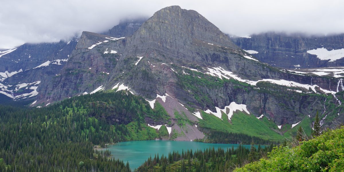Landscape blue lake green trees mountains
