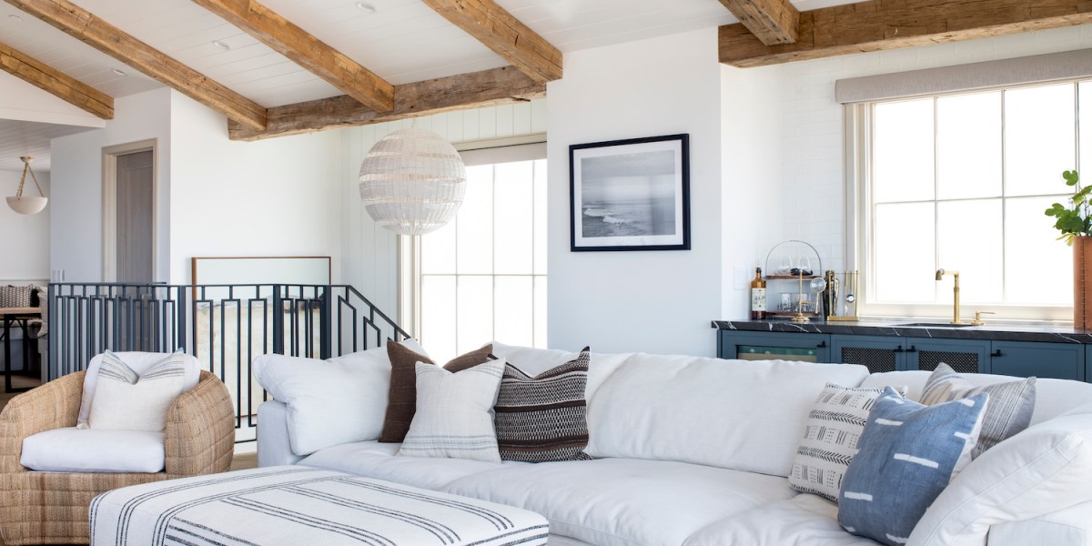 Manhattan Beach home tour by HMS Interiors living room with white leather couch.