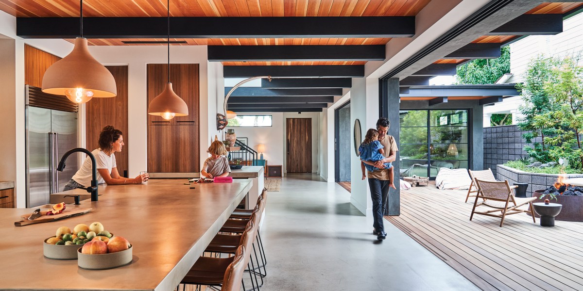 Newport Beach home kitchen with stools, beams, indoor/outdoor space