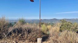 Brass and concrete outdoor shower