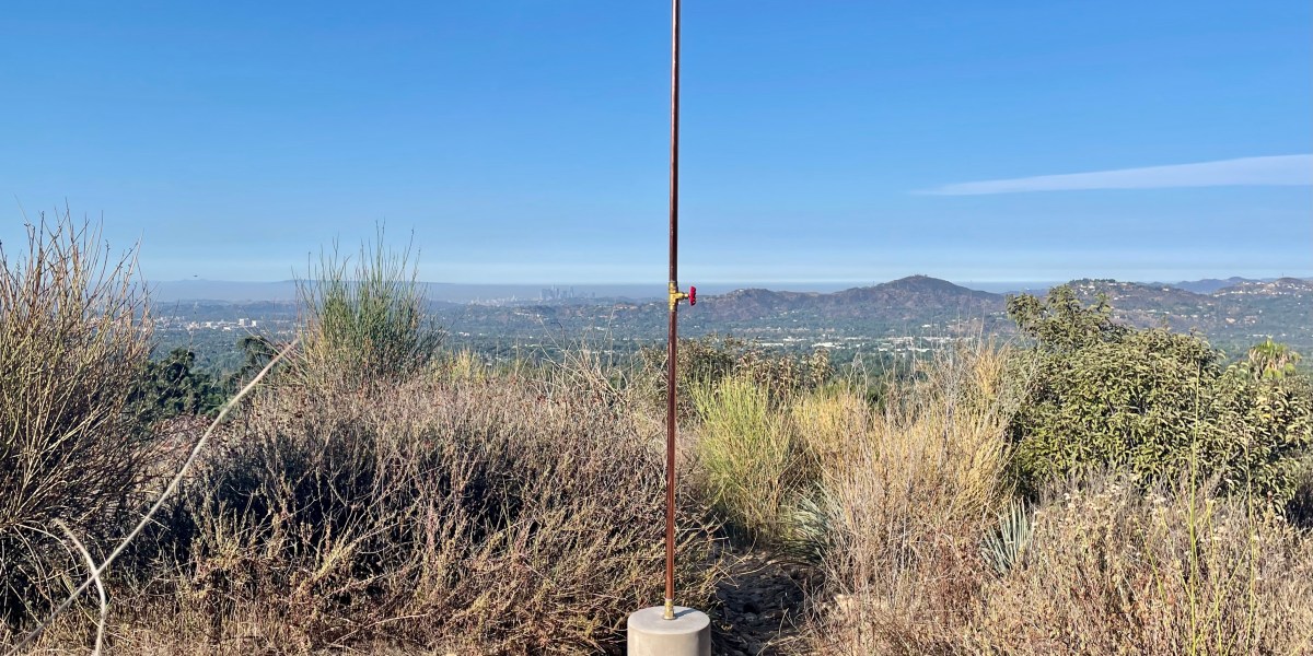 Brass and concrete outdoor shower