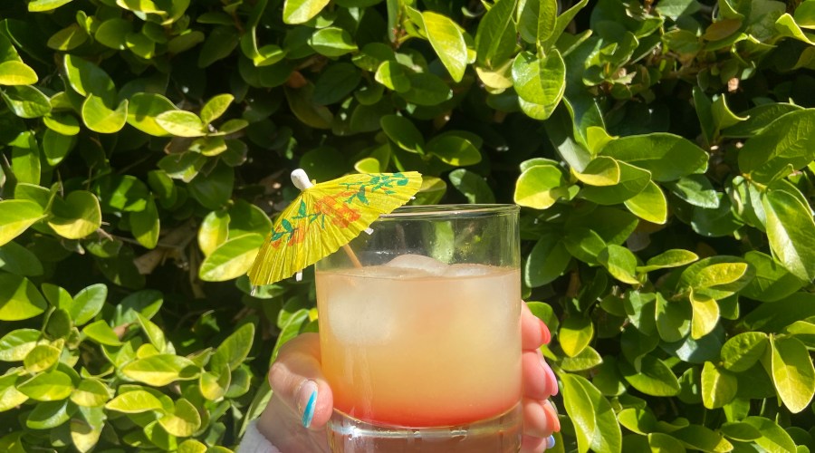 Sunset Margarita cocktail with yellow umbrella