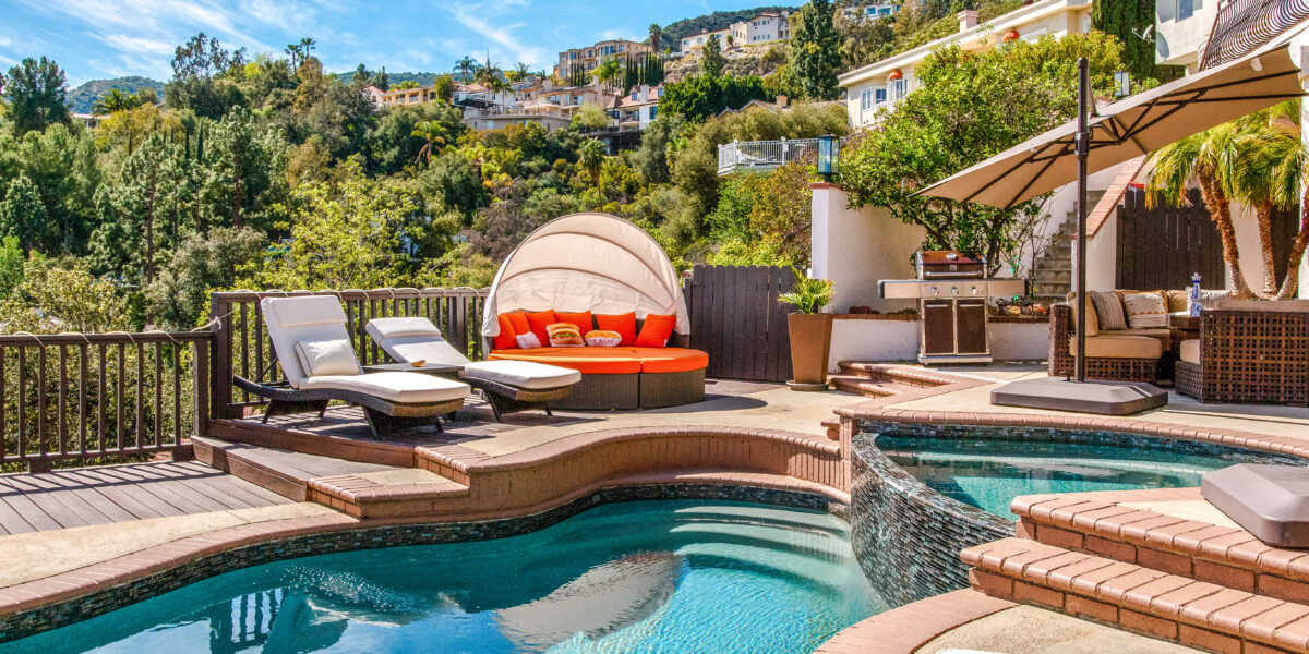 Luxury backyard pool with picturesque view