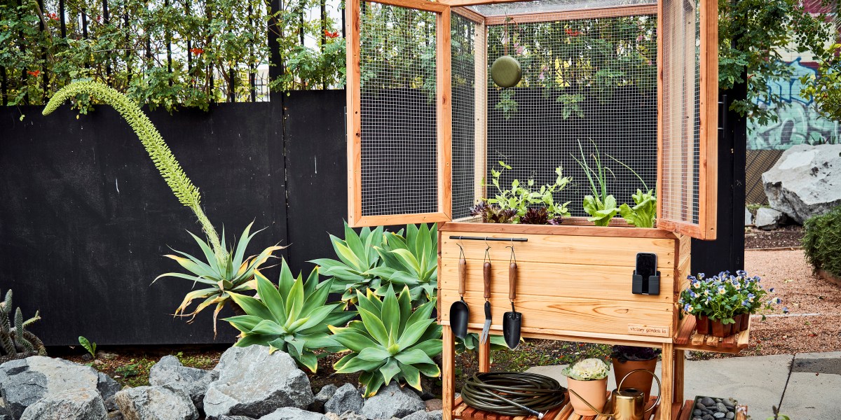 Raised Bed planter box by Victory Garden LA, surrounded by flowers and succulents