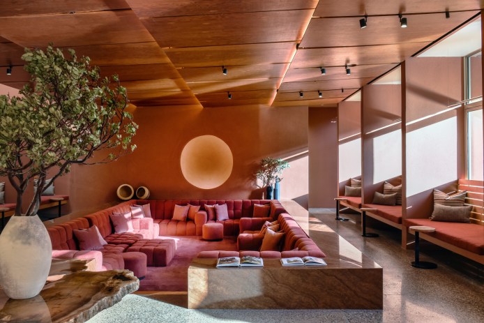 A large sunken couch in a spa lounge area.