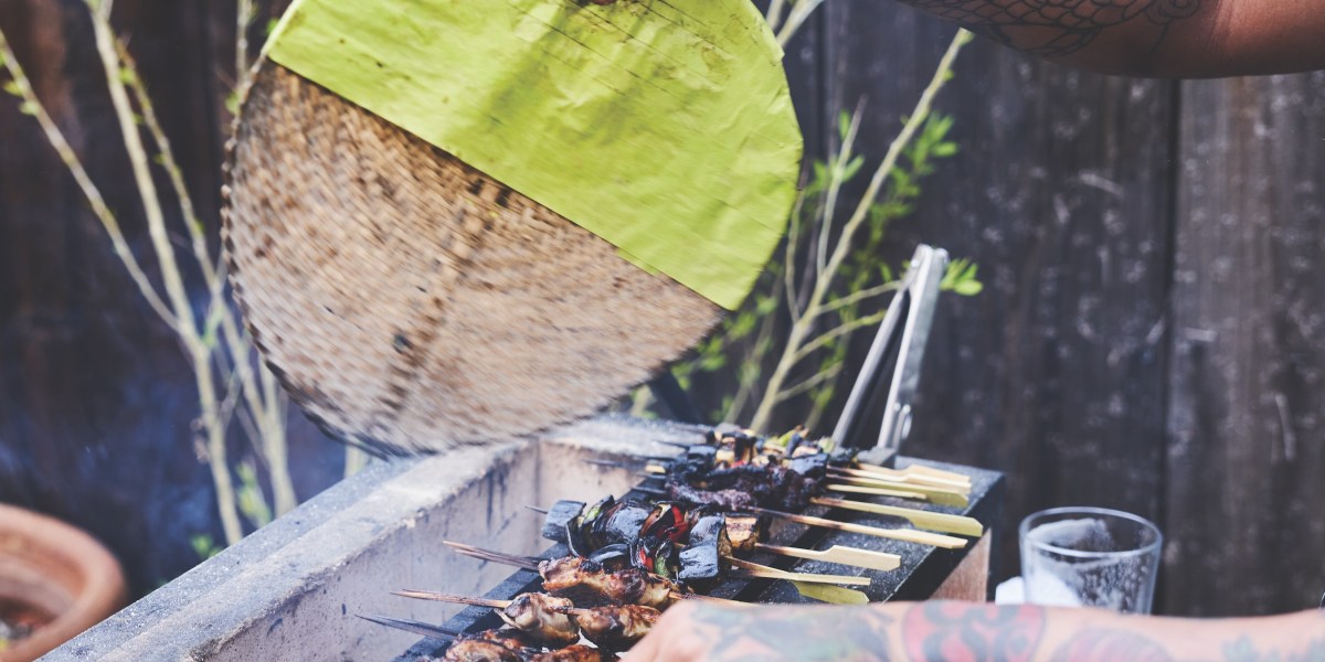 Saw Naing Fans the Grill