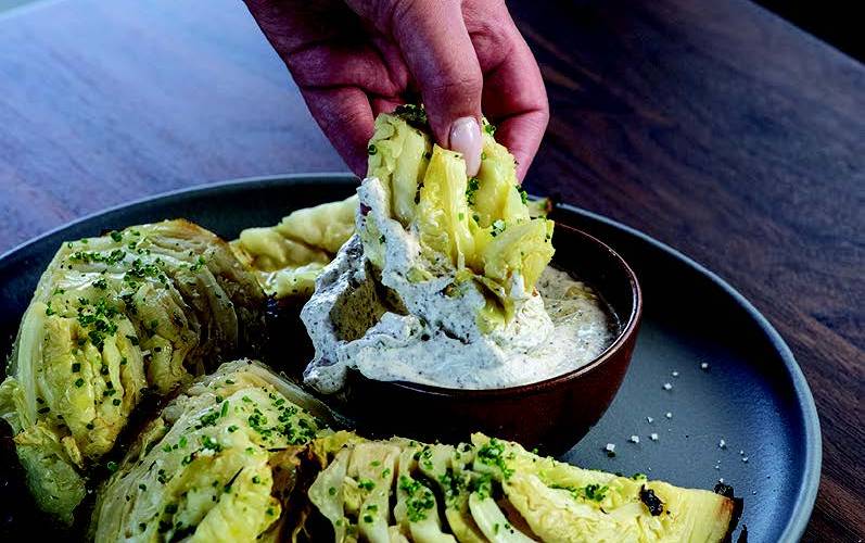 Cabbage Baked in Embers with Yogurt, Sumac, and Lemon Zest