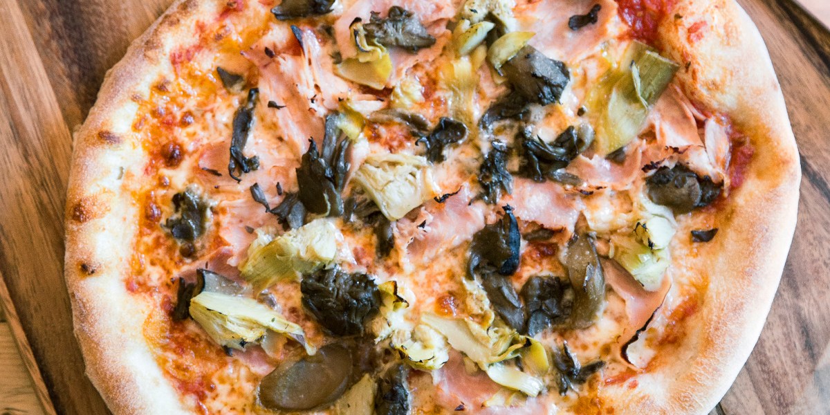 Capricciosa Pizza (Ham, Mushrooms, Mozzarella, and Artichokes)