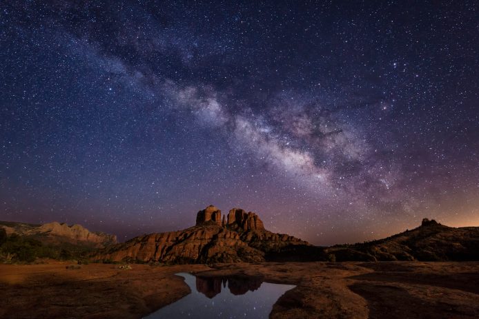 starry night sky over the red cathedral rock in sedona arizona