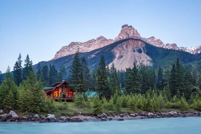 Cathedral Mountain Lodge's cozy cabins set against the mountains of B.C.