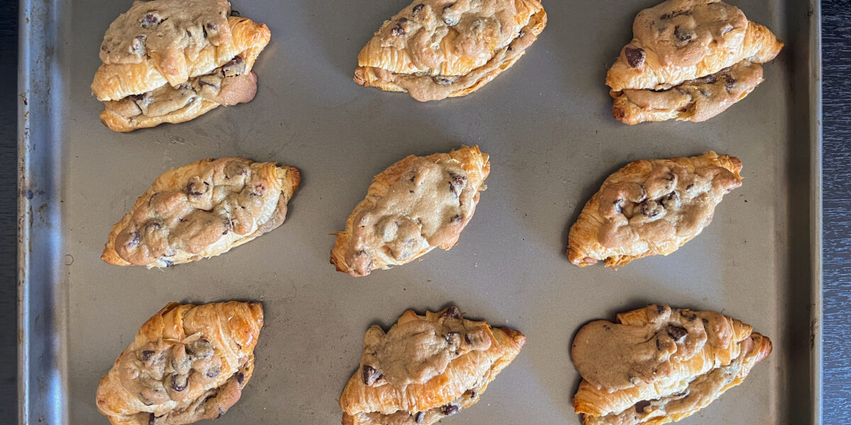 A baking sheet full of the crookie, a hybrid between croissants and chocolate chip cookies.