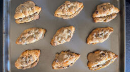 A baking sheet full of the crookie, a hybrid between croissants and chocolate chip cookies.