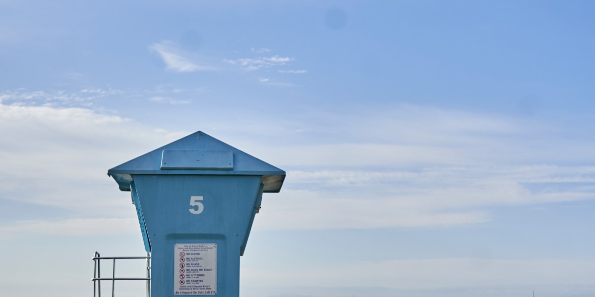 Christine Lennon with a Lifeguard Tower