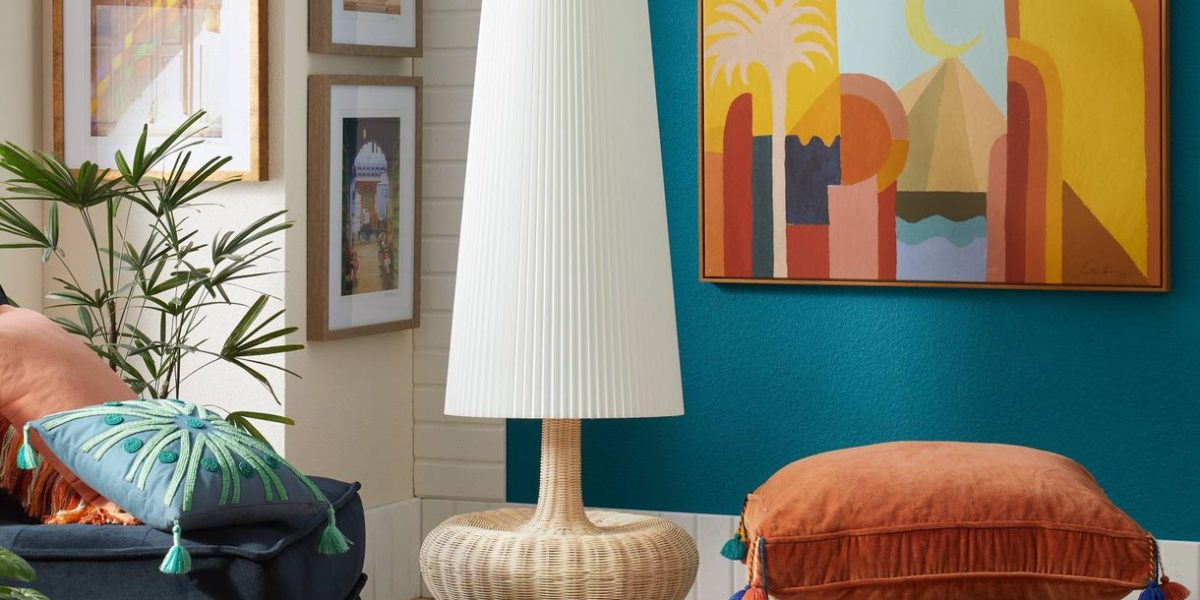 Photo of Opalhouse designed by Jungalow living room featuring canvas prints, cushions, lamps, and a chair.