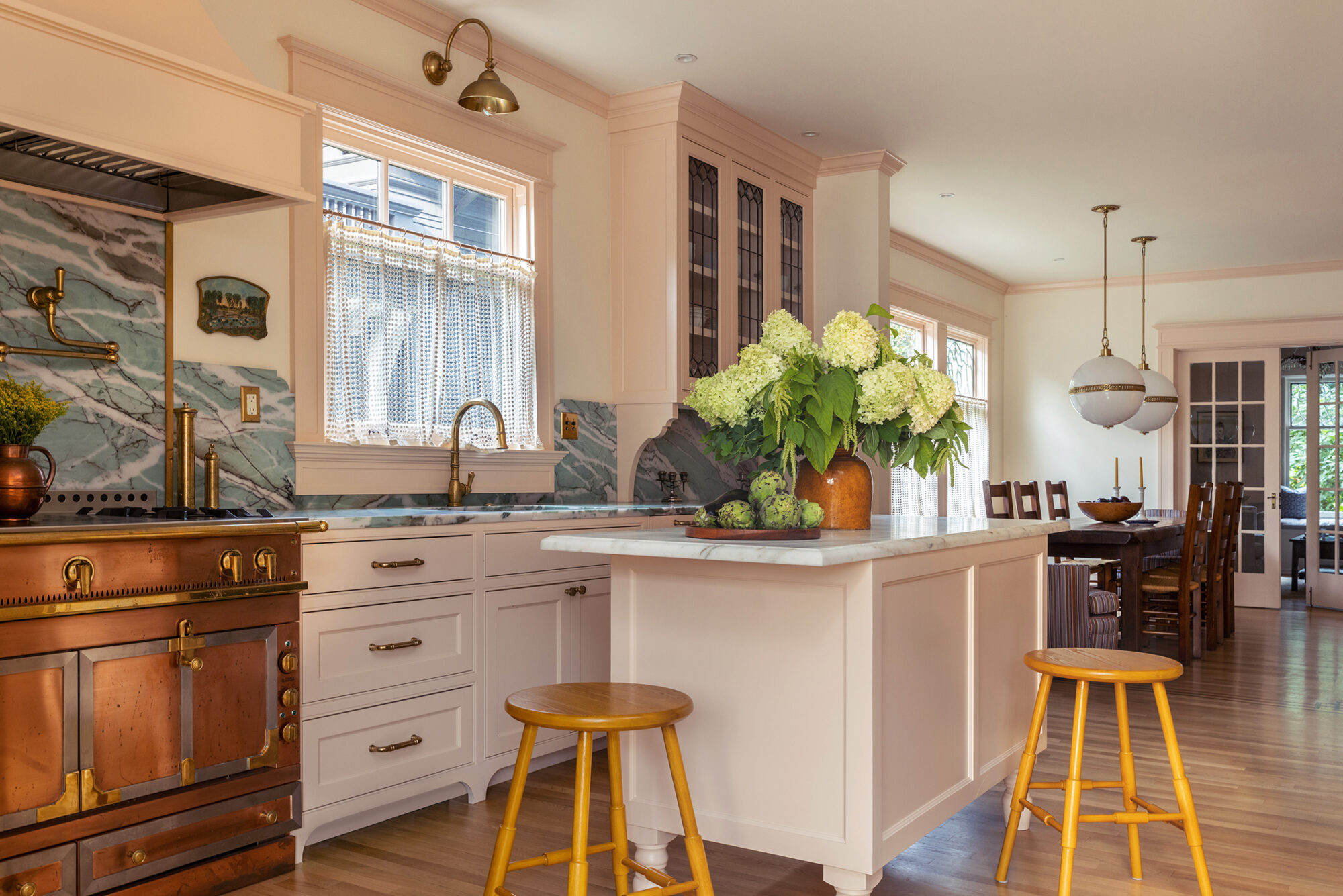 Stained plywood box houses kitchen and bedroom in renovated Seattle condo