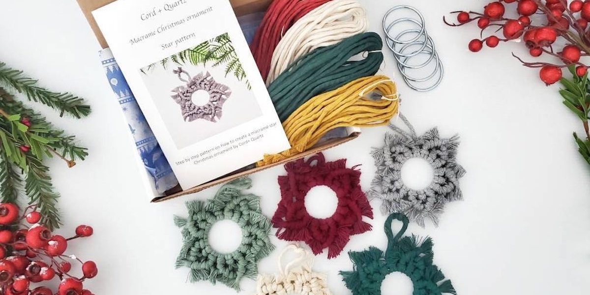 macrame ornaments of different colors with box, instructions, yarn, and rings