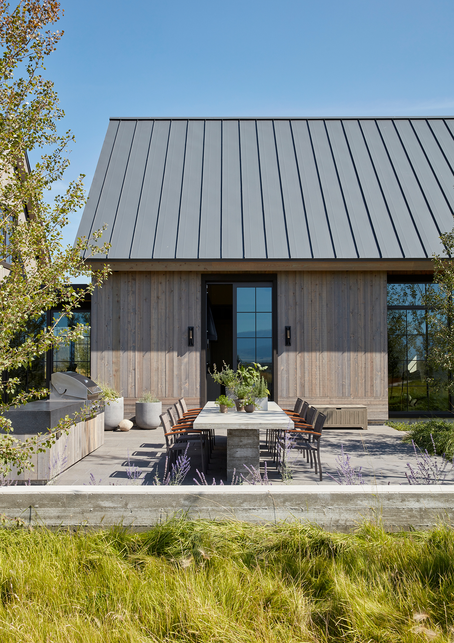 Outdoor Dining in Driggs Idaho House by Robbins Architecture