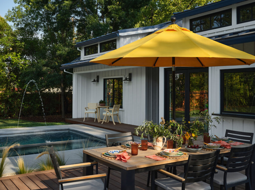 Outdoor Dining in Pool House by Design Alchemy