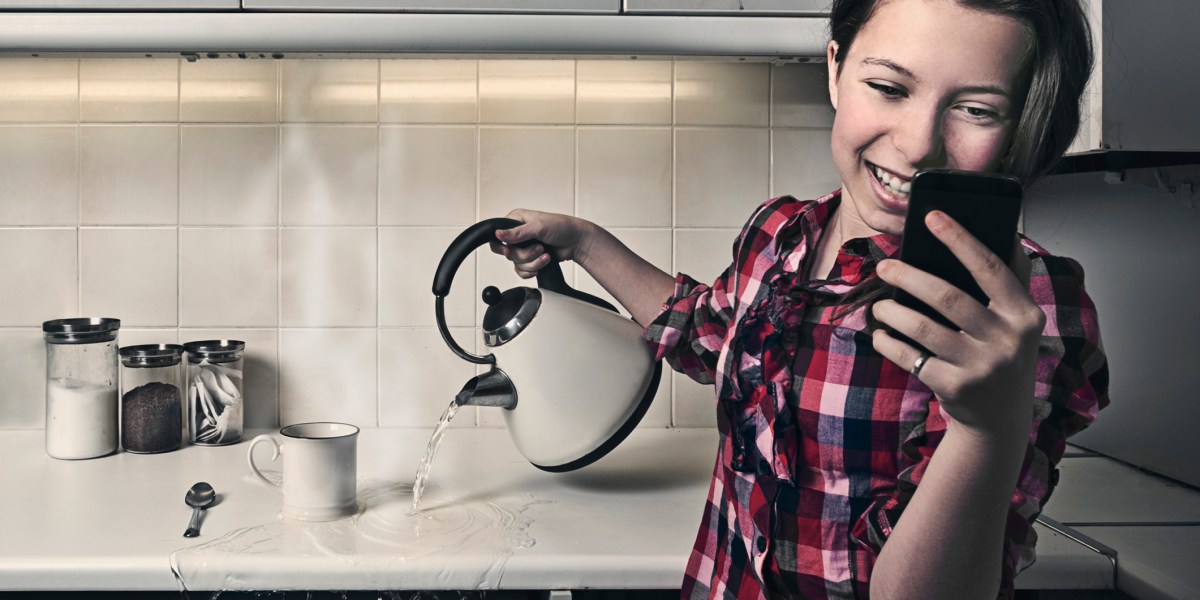 Teenage Girl on Phone While Pouring Hot Water