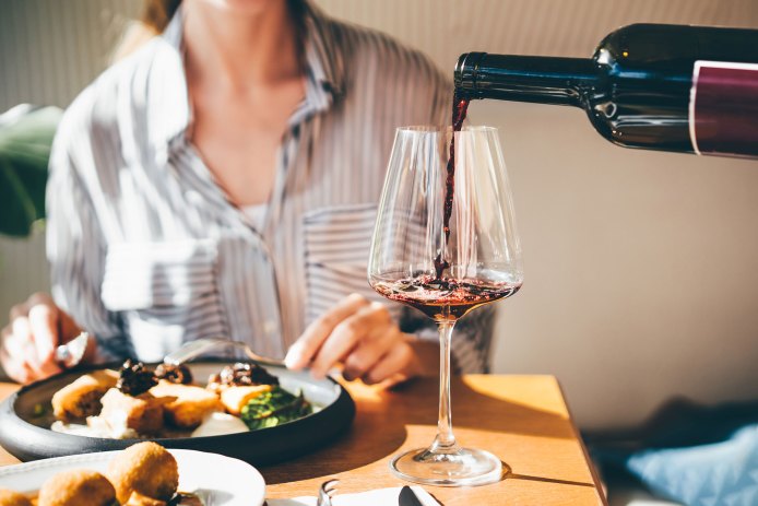 Pouring Wine in Restaurant