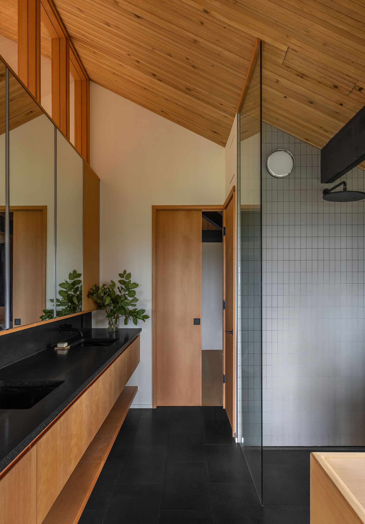 Primary Bathroom in Mori House by SHED Architecture