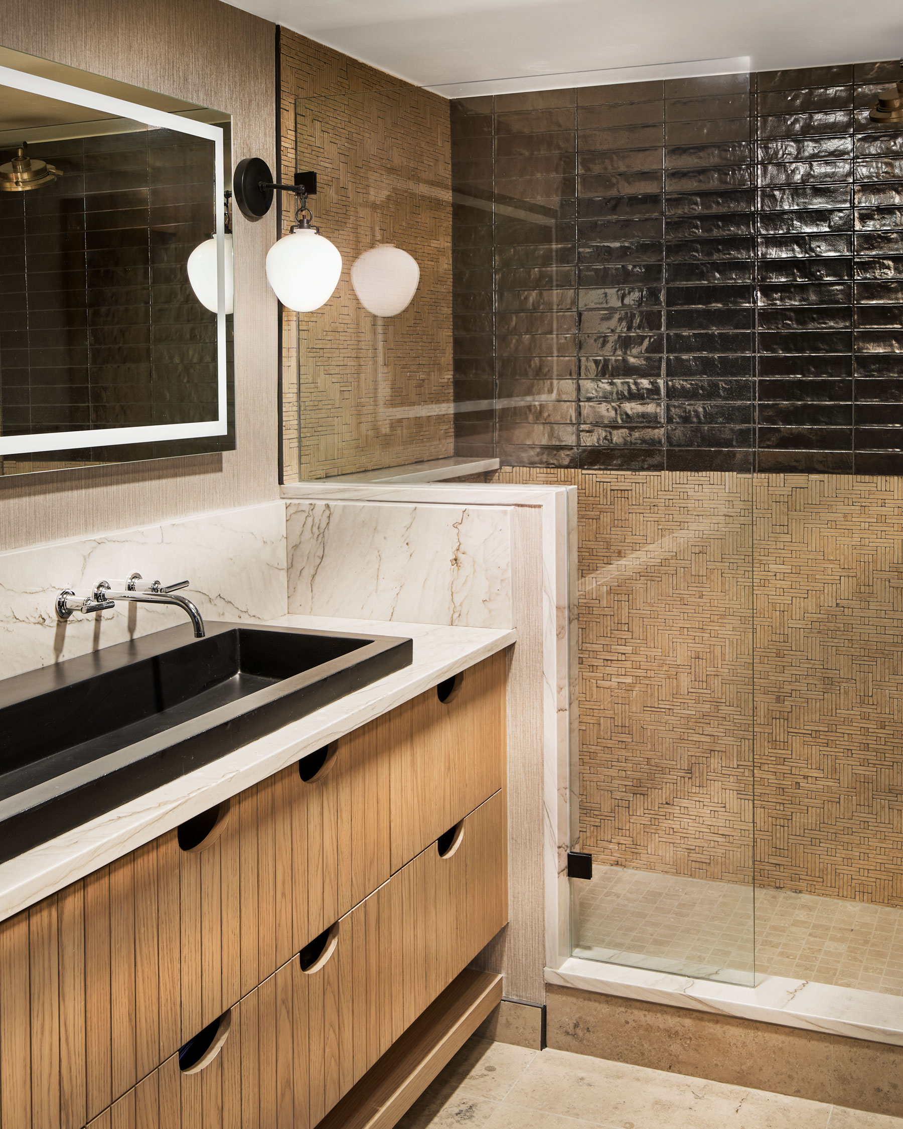 Primary Bathroom in Colorado Ski Condo by Rumor Design