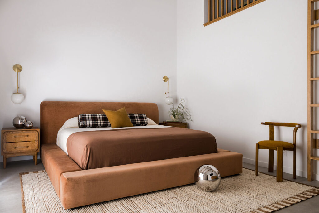 Primary Bedroom in 1970s Lake House by Lizzie Green