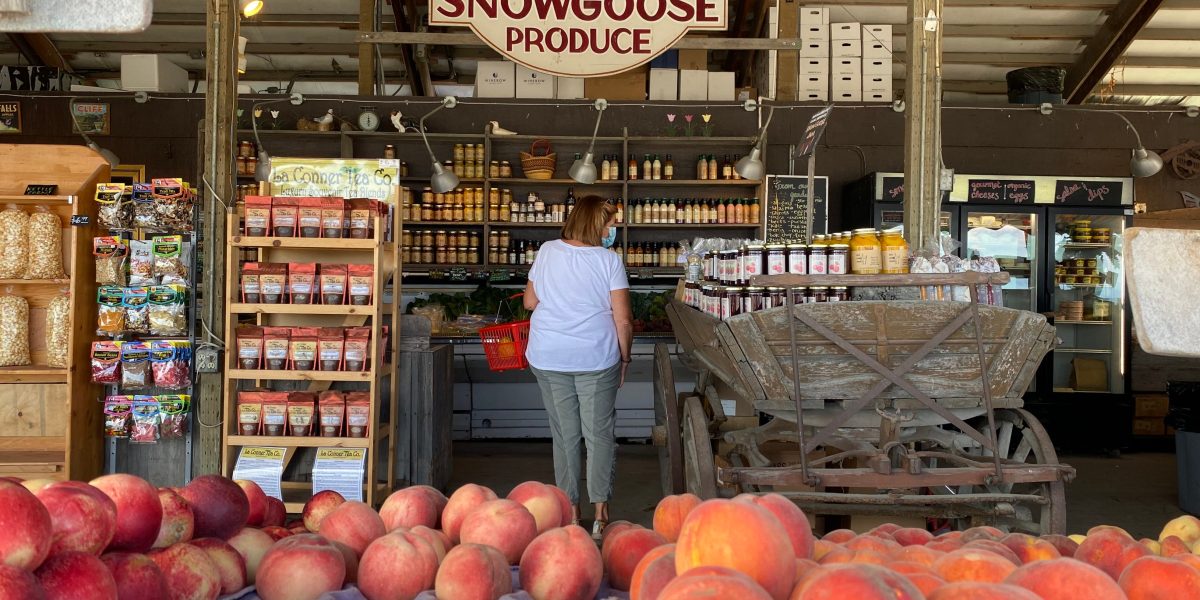 Welcome sign for Snow Goose Produce farmstand in the Seattle area