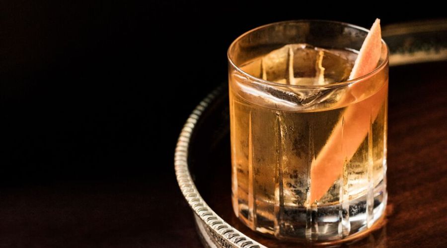 snowbird cocktail with orange on serving tray