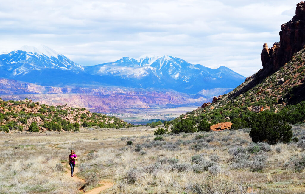 Woman Running in Hidden Valley in Moab